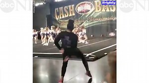 Cheerleading coaches go wild on sidelines as squad nails their routine