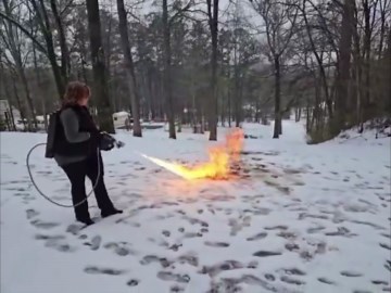 Woman uses flamethrower to clear snow in Trussville, Alabama, USA