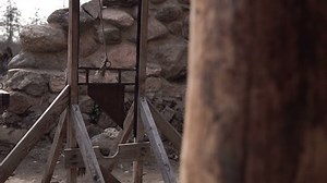 Guillotine in the old castle. An ancient instrument of execution. Execution by beheading in the Middle Ages. Executioner.