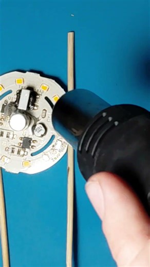 Removing Electronic Components from an LED Bulb PCB Using a Heat Gun