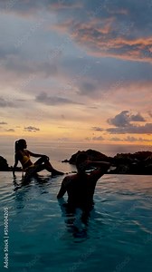 couple of men and women on a luxury vacation at a pool villa. men and women by swimming pool