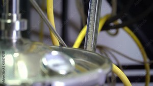 Production of perfume essences using steam in a distillation cube in a small alpine village. Distillation apparatus is heated to the desired temperature. Real people.