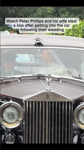 Newlyweds Peter Phillips and his wife steal a kiss in the car