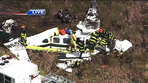 Rescue crews are working to remove the pilot from the wreckage. He will be airlifted to a hospital as soon as he is stabilized. | WSVN-TV