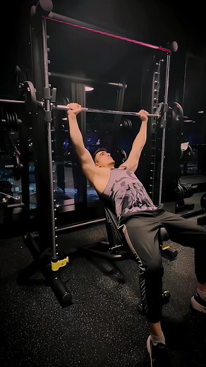 In the incline Smith machine bench press, proper bench placement is crucial. Take your time to position the bench correctly, ensuring that the bar doesn't touch your neck or chin during the exercise. A well-adjusted bench enhances both safety and effectiveness, allowing you to target the upper chest | ForcaFit