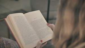 Blonde woman reading a book - Free Stock Video