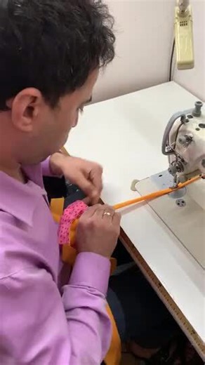 Man Sews Safety Mask for Protection Against Coronavirus Pandemic