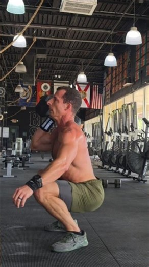 burpees over dumbbell with dumbbell thrusters