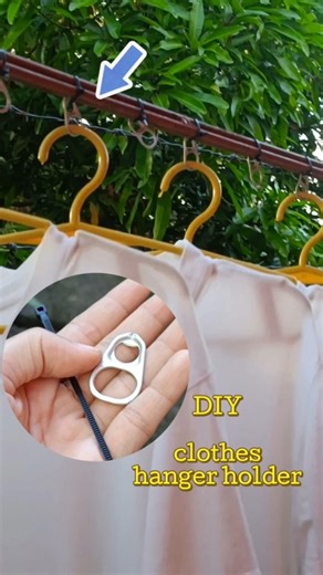 try this DIY clothes hanger holders,even if it's windy it surely stay in place