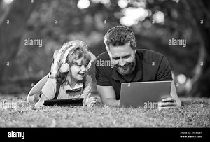 webinar video lesson. online education on laptop. father and son use modern communication technology Stock Photo - Alamy
