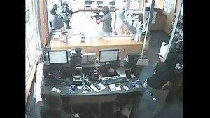 Dramatic Video Shows Armed Robbery at Cellphone Store