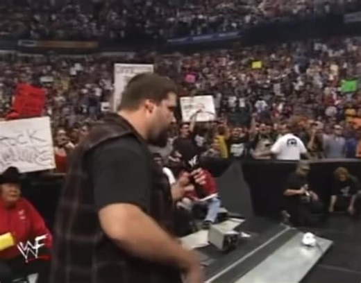 On July 23, 2000 WWF’s third and final “Fully Loaded” pay-per-view took place in front of 16,504 fans at the Reunion Arena in Dallas, Texas. The main event was for the WWF Championship as The Rock defended the title against Chris Benoit (with Shane McMahon). The match stipulated that if The Rock was disqualified, he would lose the title. He was disqualified, and as a result, Benoit won the title. However, then WWF Commissioner Mick Foley restarted the match. Rock then pinned Benoit after a Rock 