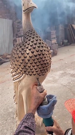Carving a Bird Statue from Wood.