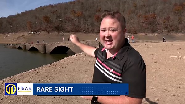 Remnants of abandoned town, bridge buried by water revealed as lake level drops