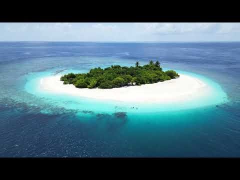 Discovering a pristine uninhabited island in Maldives. 4K Drone tour