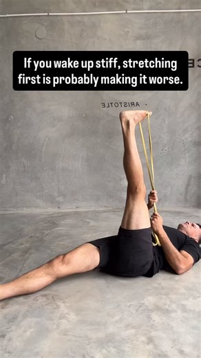 Iain Behr Coach on Instagram: "This is why slow movement works better than stretching first thing. When you wake up stiff, your body is cautious. Overnight, your nervous system downshifts.�Movement hasn’t happened for hours.�So the default setting is protection. Stretching harder first thing sends the wrong message. It says:�Something’s wrong.�Pull.�Defend.�Hold on. That’s why aggressive stretching often makes you feel tighter later. �The body doesn’t relax under threat. Slow movement does the o