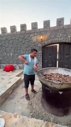 Outdoor Meat Cooking Techniques in a Rustic Setting