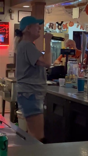 This is our bartender Stephanie singing for us at karaoke tonight. She can really multitask. Very good bartender too! | Glenn Gillespie