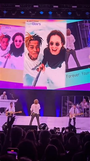 The tribute was an AI generated video showing the rocker posing with other dead music icons. | News.com.au