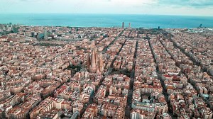 Aerial view of the Barcelona city from above at sunset. Timelapse 4k aerial view of life in Barcelona.
