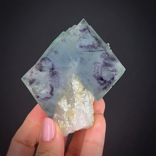 Fluorite on Quartz with Muscovite - Yindu Ag-Pb-Zn deposit, Hexigten Banner, Chifeng City, Inner Mongolia, China More info: https://www.irocks.com/minerals/specimen/53458 A stunning "pair" of intricately "zoned" fluorite octahedrons from the famous Yindu metals deposit, Inner Mongolia, China. These crystals are as fascinating as they are beautiful! They are a transparent, medium sea-green overall, however, they have these irregular, inky purple, unusually "ring-like" curved zone areas within tha