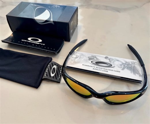 Taste.bkk on Instagram: "Oakley Minute Jet Black Frame Ruby Iridium Lens + Red Logo + Silver Side Logos"