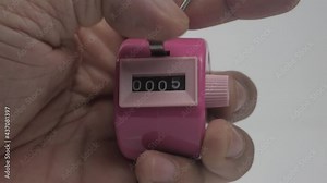 Mechanical hand operated tally counter used mainly for counting people entering an event or building.4K 2160p 25fps UltraHD footage