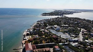 Aerial drone view from above of bridge and sandy beach on Black sea in Zatoka resort, Karolino-Bugaz, Odessa region, Ukraine. Hotels and apartments, architectural complex and houses.