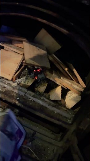 Starting open fire using newspaper as draw to start.