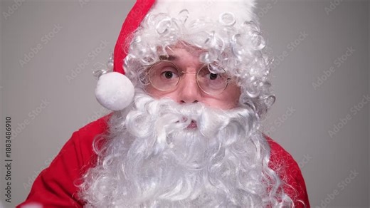 Santa claus waving hand to camera