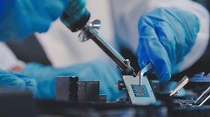 Download Close up portrait of computer engineer's hand is holding CPU's computer. for free