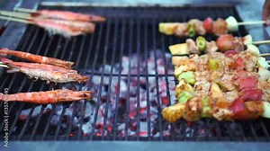 Pork meat vegetables and shrimp prawn skewer on charcoal grill