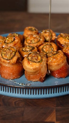 Jalapeño Popper Pig Shots 🐷🥃 Recipe ⤵️⤵️⤵️ This recipe is perfect for this 4th of July weekend! I’m using the Limited Edition “Red White & BBQ” pellets from @bearmountainbbq these will add a firework show of flavor to your food this weekend! 🧨 Makes about 20-22 Pig Shots Ingredients: 12 oz Beef Smoked Kielbasa 1 lb “Thick” Cut Bacon 12 oz Pimento Cheese 8 oz Whipped Cream Cheese 1 Tbsp BBQ Rub 4 oz Cheddar Cheese 3 Jalapeno 2 oz Cooked Bacon Pieces 4 Tbsp Honey How to: 1. Cut Kielbasa 1/2 an 