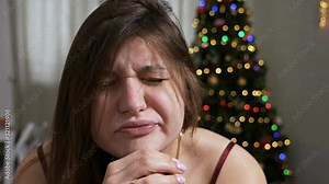 Heavy morning. Young beautiful sleepy woman suddenly woke up and sat on the bed