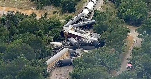 35 cars piled on tracks after train carrying hazardous materials derails in Texas