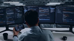 clip-3424538735-back-view-asian-man-developer-working-mobile