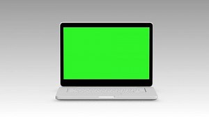 Modern laptop appearing from the side white background and green screen