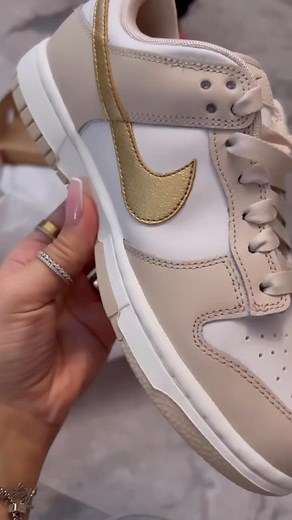 With neutral tones and a swoosh of metallic gold, these @nike Dunks Low Phantom Metallic sneakers can be found on reseller sites for around $228. Hot! Or Hmm…? * #fashionbombdaily #nike #bombaccessories 📸 @zi.______ Blogged by @limo_x | Fashion Bomb Daily