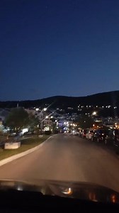 There's nothing quiet like the first glimpse of Vathi at night - golden lights tumbling down to a silver sea #Vathi #Samos #NightView | Vilkap