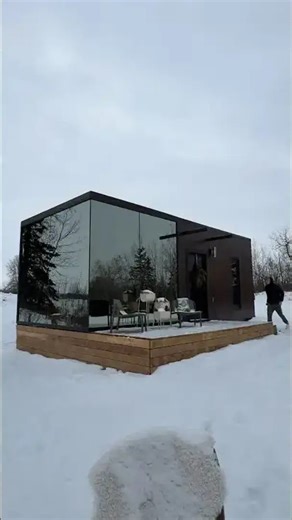 Touring a prefab home with floor to ceiling glass in Alberta