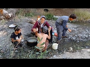 Bathing a child in the mountains and the hard life of nomads and washing children without a bath