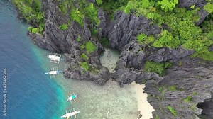 Aerial view of beautiful karst scenery and turquoise ocean water around El Nido, Palawan, Philippines. El Nido is famous for its island hopping and snorkeling tours to secluded beaches and lagoons.