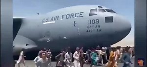 Shock! Afghans Climb A Plane And Fall From The Plane