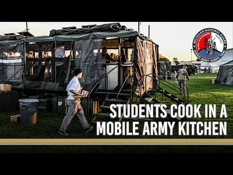 Students cook on Army Mobile Kitchen Trailers (MKT's)
