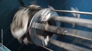 Industrial production. Making braid pipe, cable sleeves. Manufacture of metal shielding braids for electrical cables. High-speed braiding machine. Winding the finished braid over the reel.