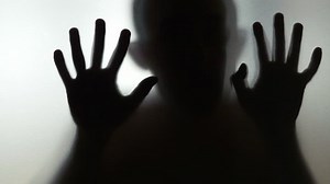 clip-1016683912-scary-human-behind-frosted-glass-4k-slow