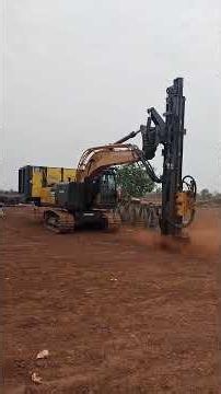Solar plant me piling ke liye augering by Machine