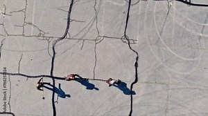 Course of worker patching are filled, asphalt cracks are sealed, bitumen emulsion is applied to restore road surface.