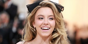 Sydney Sweeney Bares It All in a Black Lace Bodysuit and Thigh-High Feather Boots