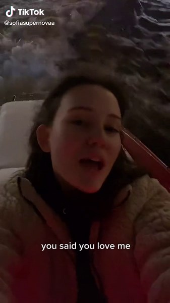 Emotional Nighttime Boat Ride with City Lights